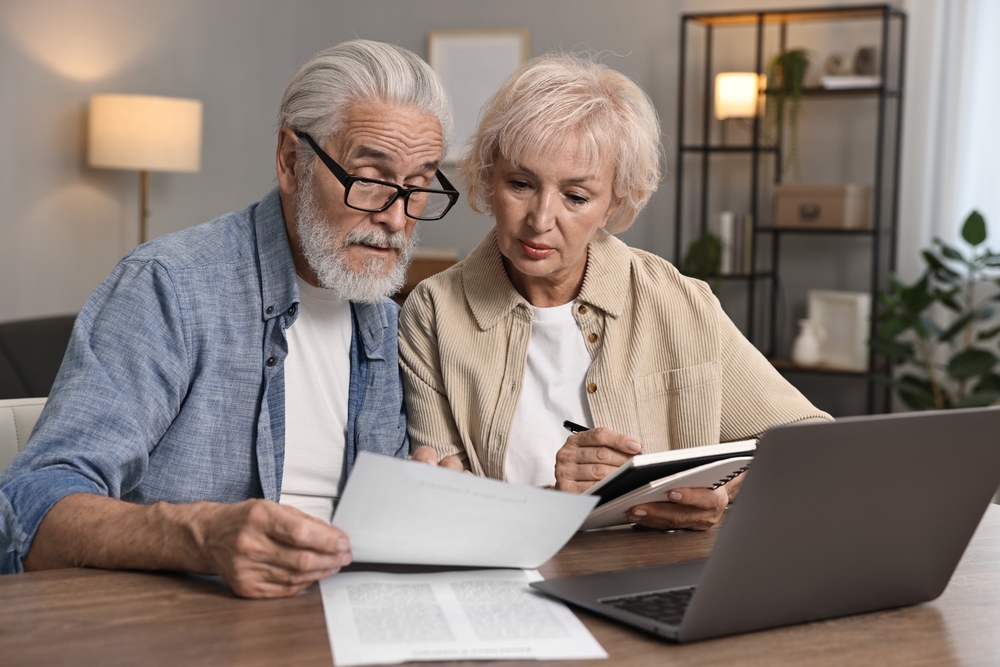 pensioners talking at computer