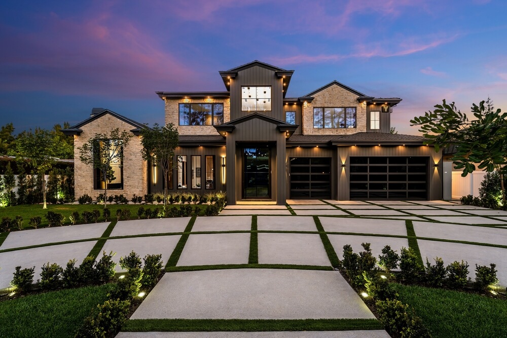 Modern mansion exterior at dusk