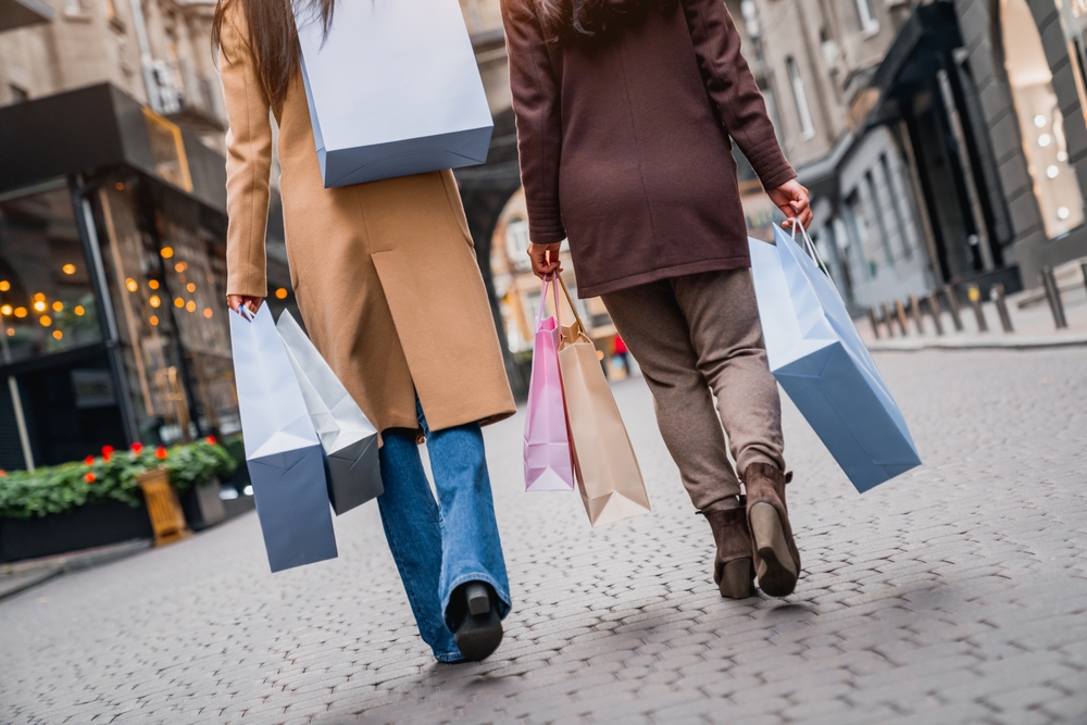 cropped photo of people with lots of shopping bags