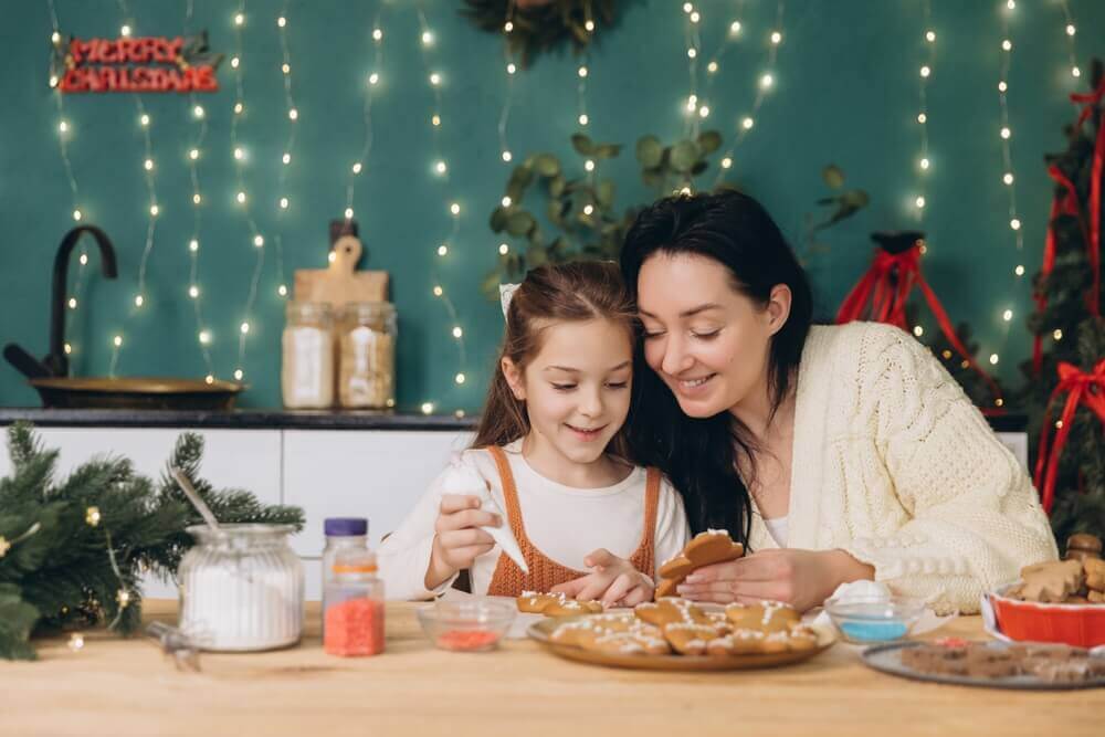 Mom and daughter making handmade Christmas decorations