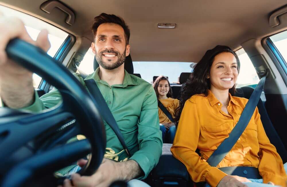 family driving a car