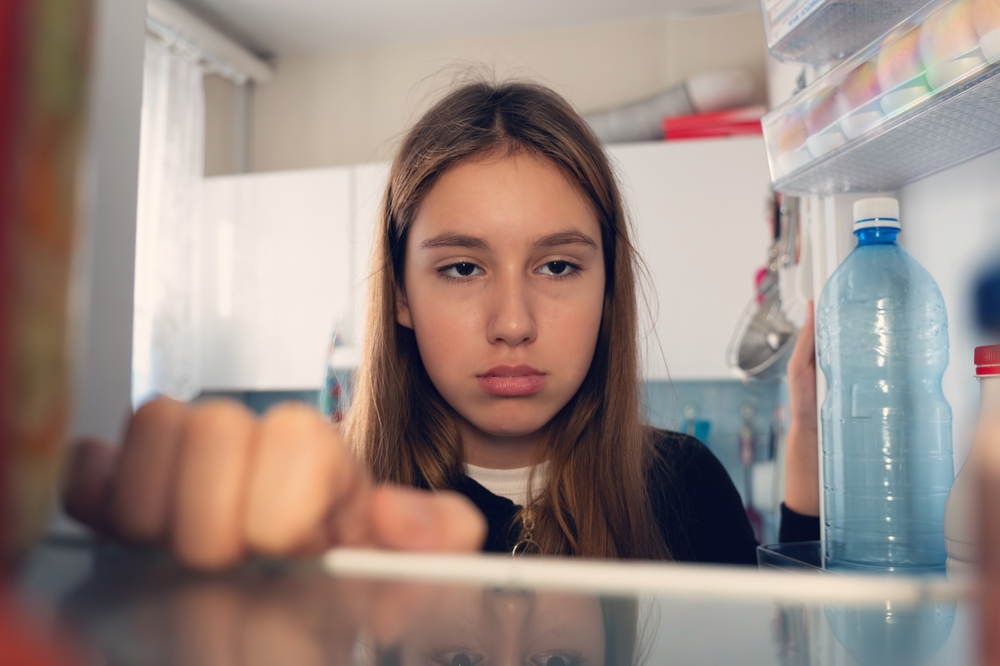 teenager with empty fridge