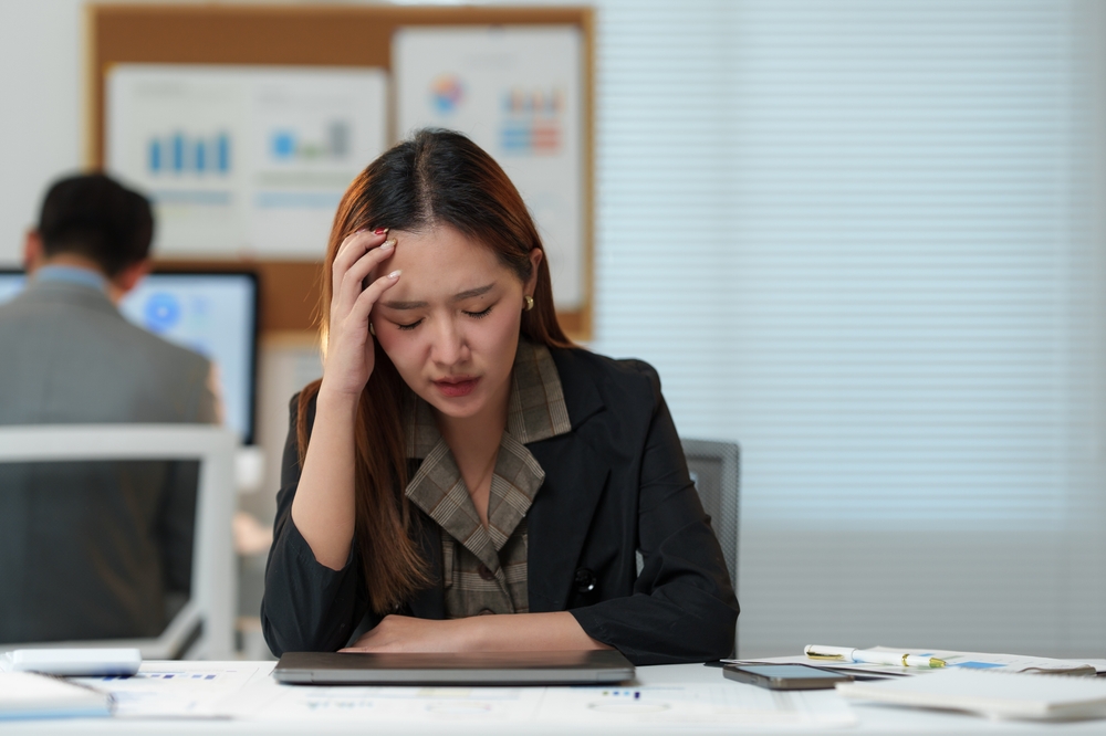 woman in pain working
