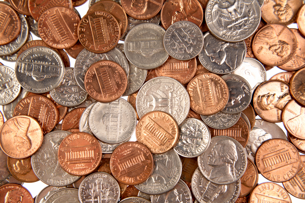 A spread of U.S. pennies, nickels, dimes, and quarters