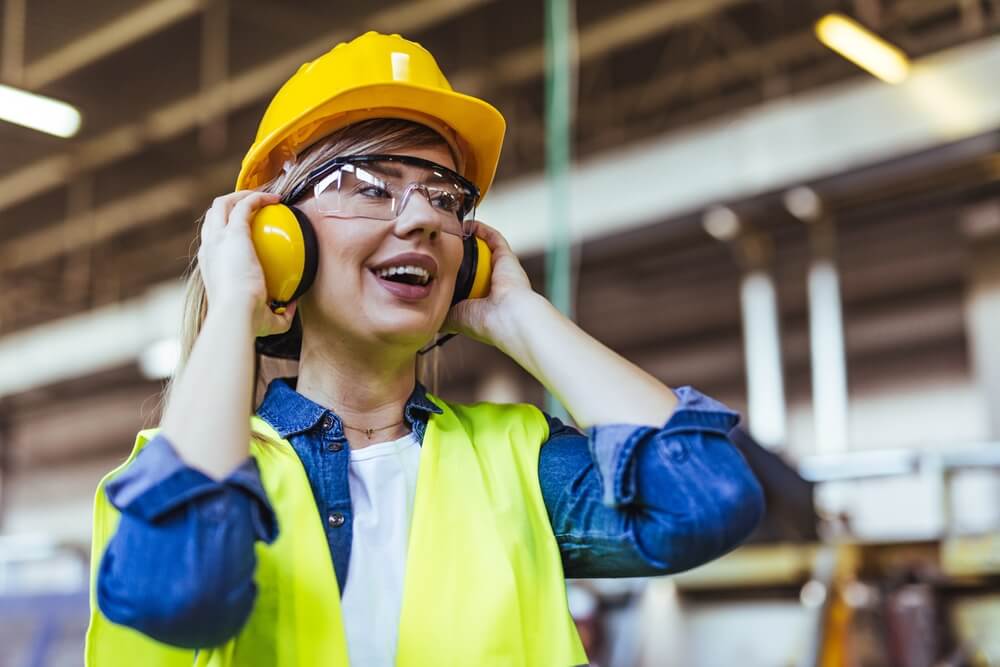 Confident worker in safety gear on job site