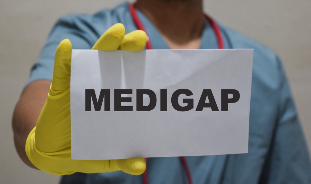 medigap sign being held by health professional