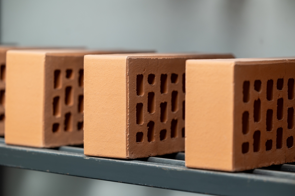 Fired ceramic bricks lined up for quality inspection during production