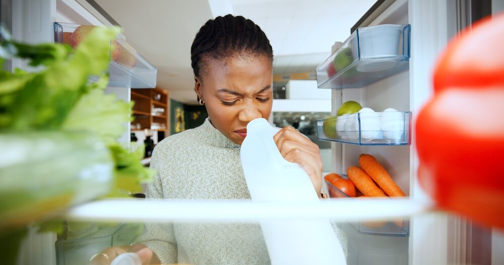 smelling expired milk in fridge
