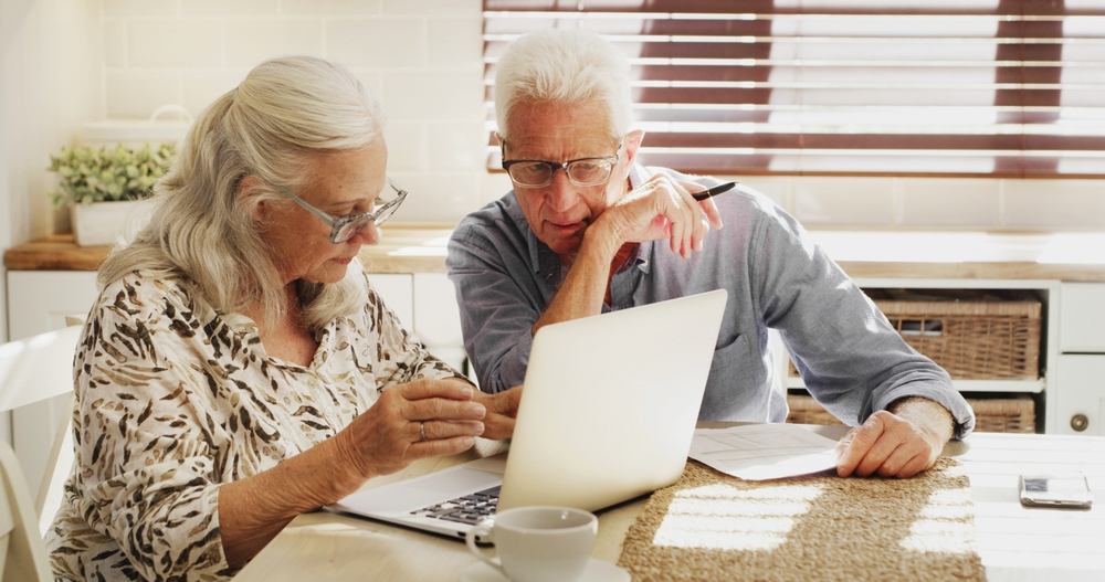 elder couple working out finances