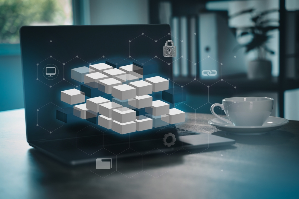 Laptop with connected digital blocks, network lines and security icons