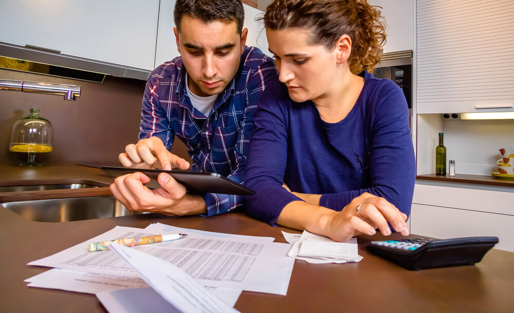 Worried person reviewing bills