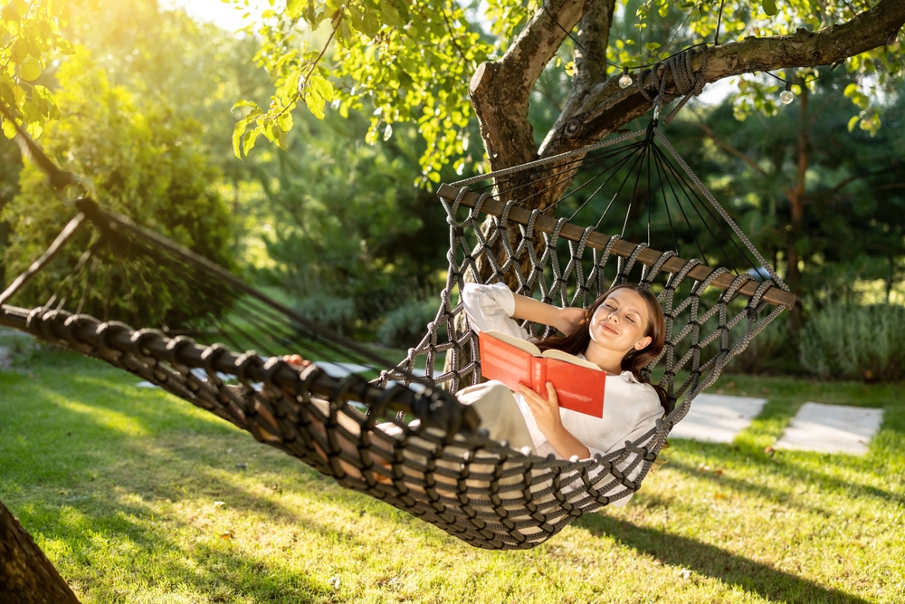 relaxing woman in hammock at weekend
