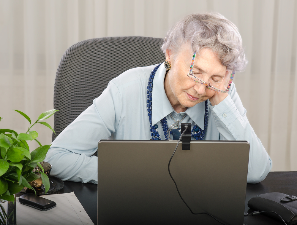 old person falling asleep in office