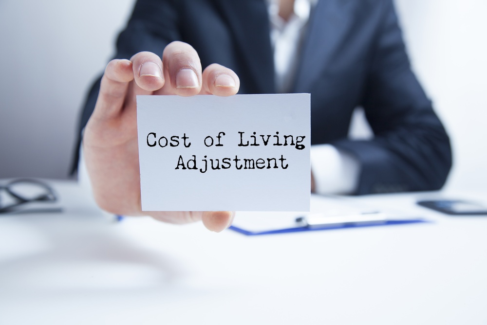 cost of living adjustment written on card