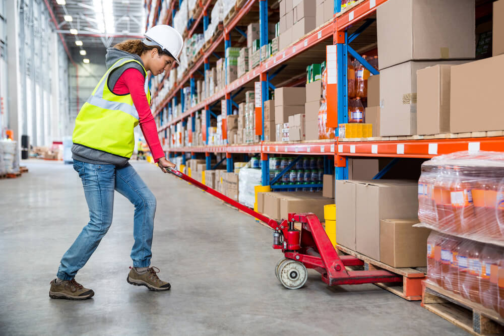 Warehouse worker stacking boxes