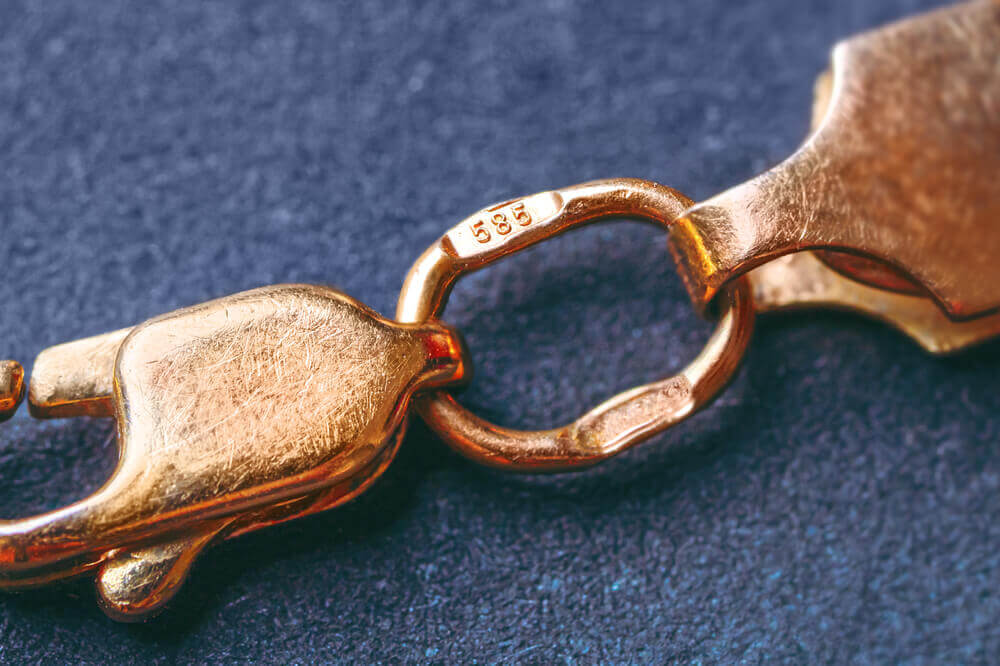 Bracelet shows symbols stamped on jewelry.