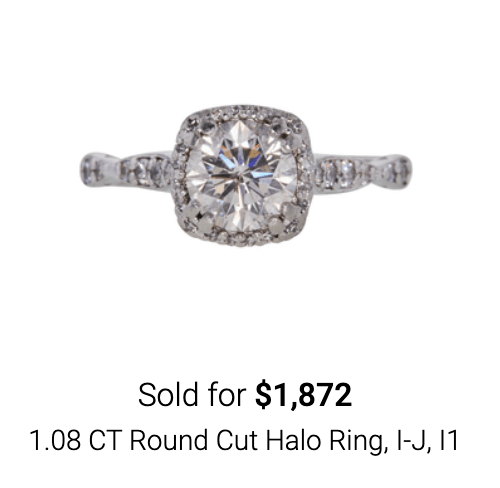 Round cut halo diamond ring sold on online jewelry auction site Worthy.