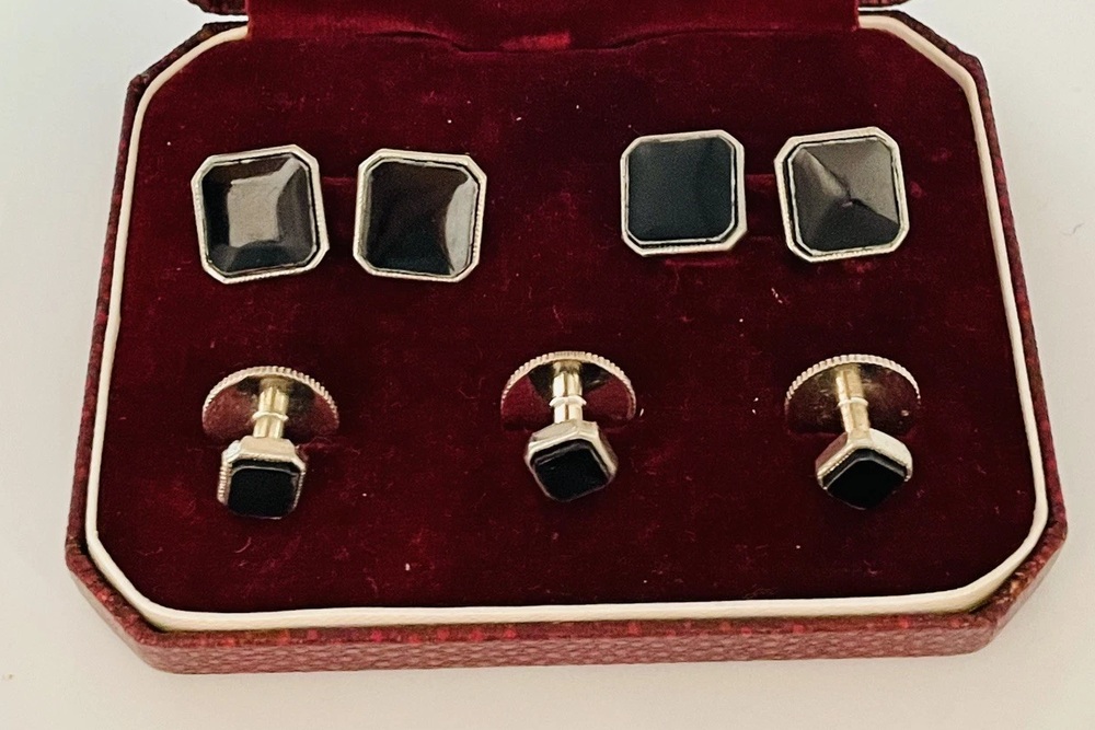 Black faceted Bakelite cufflinks and matching shirt studs in a burgundy-lined presentation box