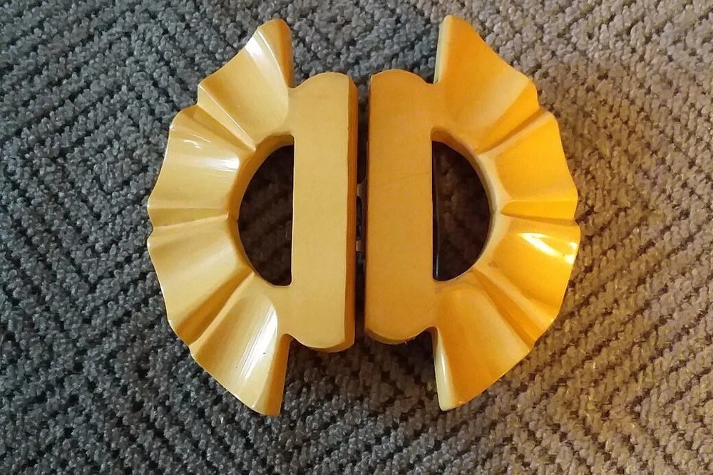 Two-part butterscotch Bakelite belt buckle with a carved fan design