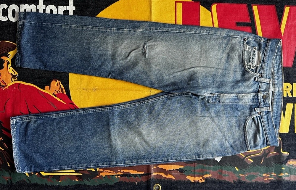 Vintage Levi's 505 jeans laid flat on a Levi Strauss display cloth
