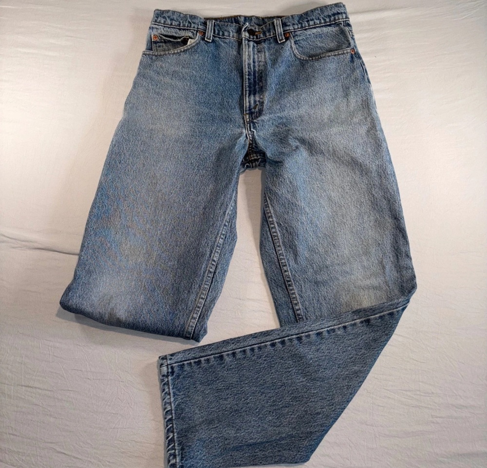 American-made 1991 Levi's 550 relaxed-fit jeans with one leg folded