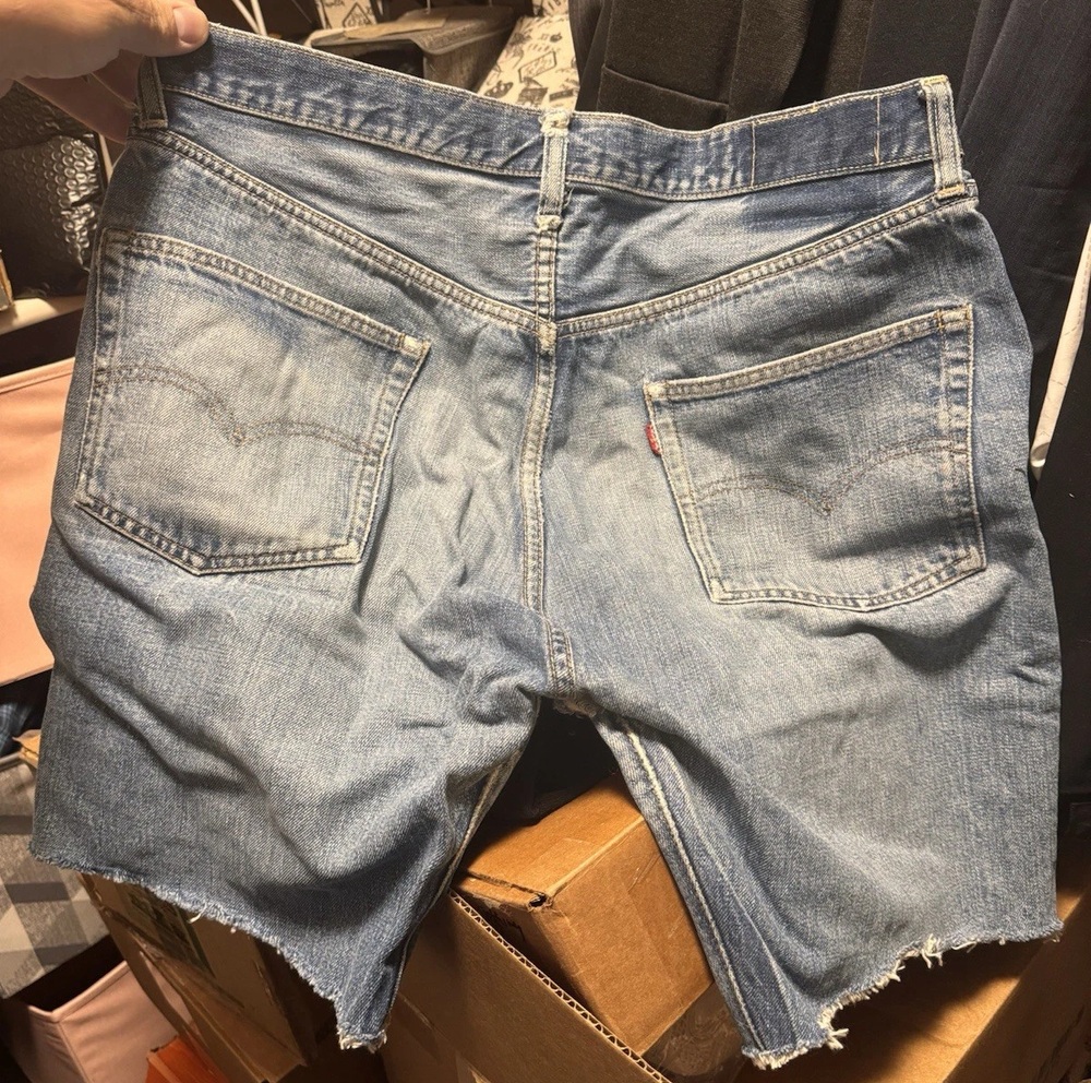 Back of vintage Big E Levi's cutoff shorts showing pocket stitching and raw hems