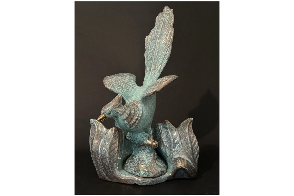Turquoise California Originals bird TV lamp with gold accents