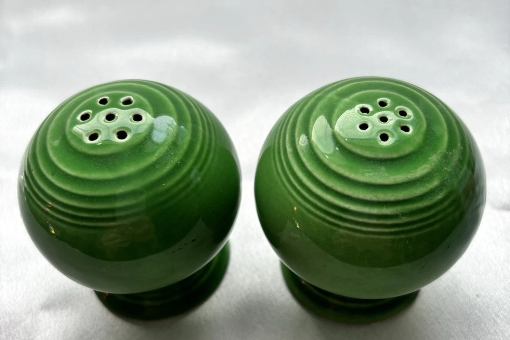 Green Fiesta ball-shaped shakers with concentric rings around the holes.